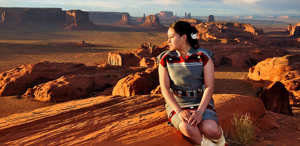 Navajo girl overlooking Monument Valley